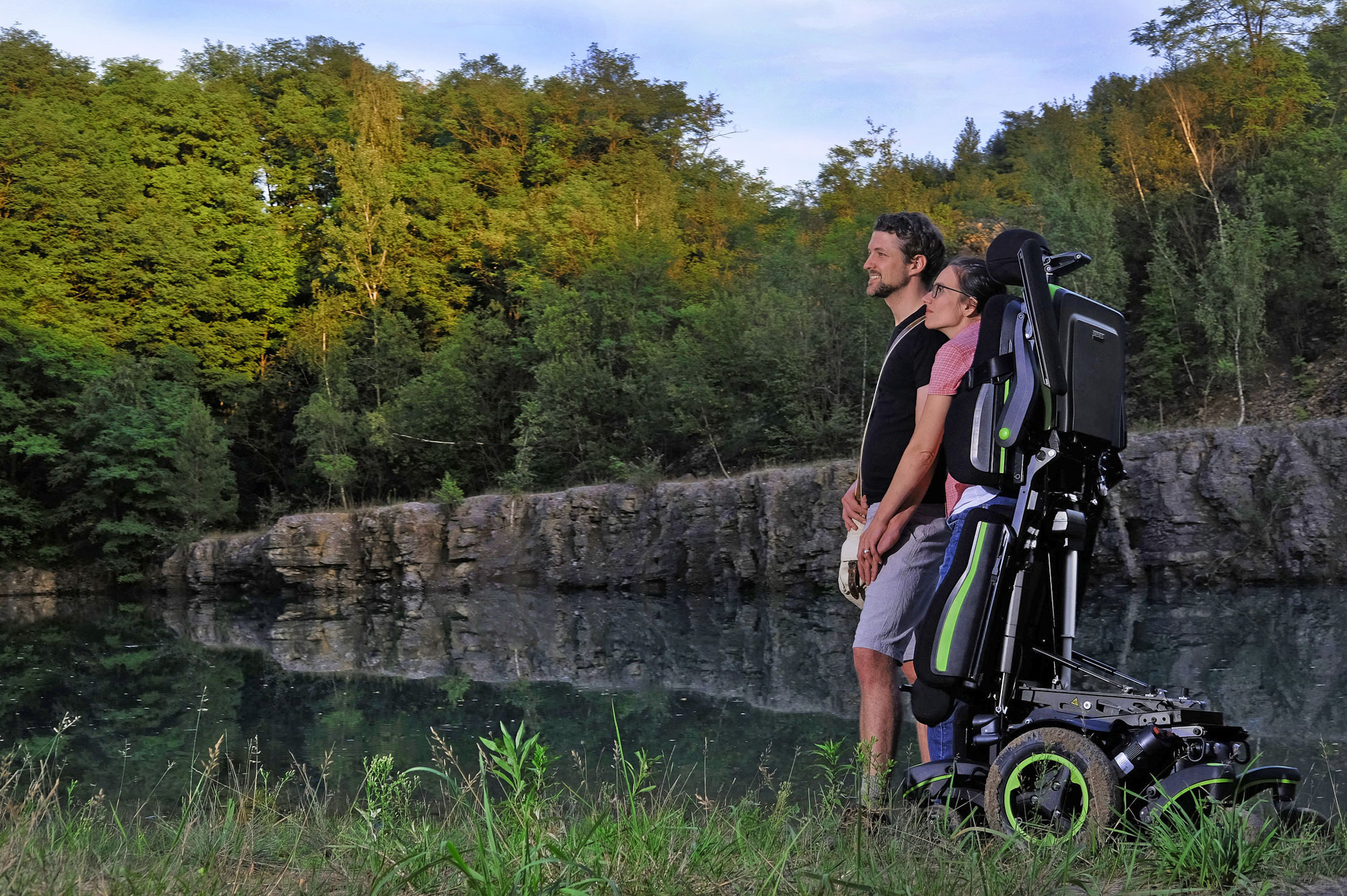 Couple outdoors with Q700-UP M Sedeo Ergo Powered Chair