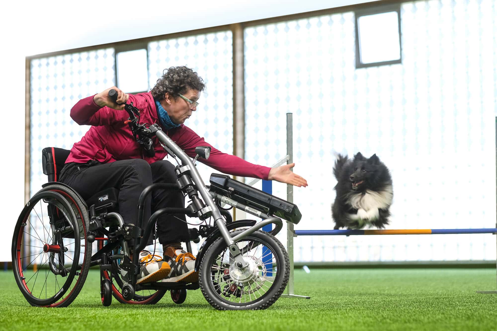 Lady sat in Quickie Life F Chair with power pack add on