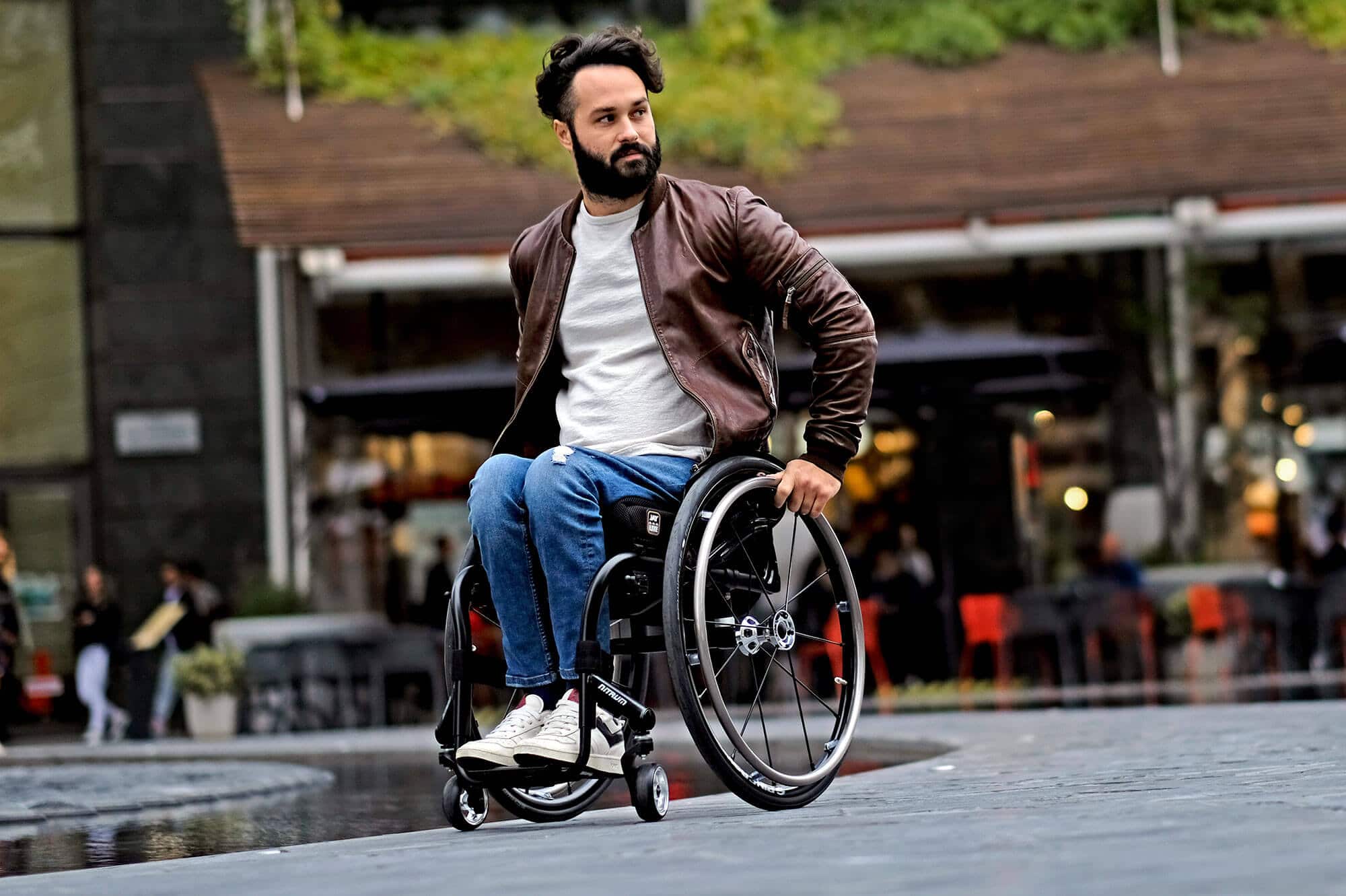 Stylish Man riding a Quickie Nitrum Active User Chair