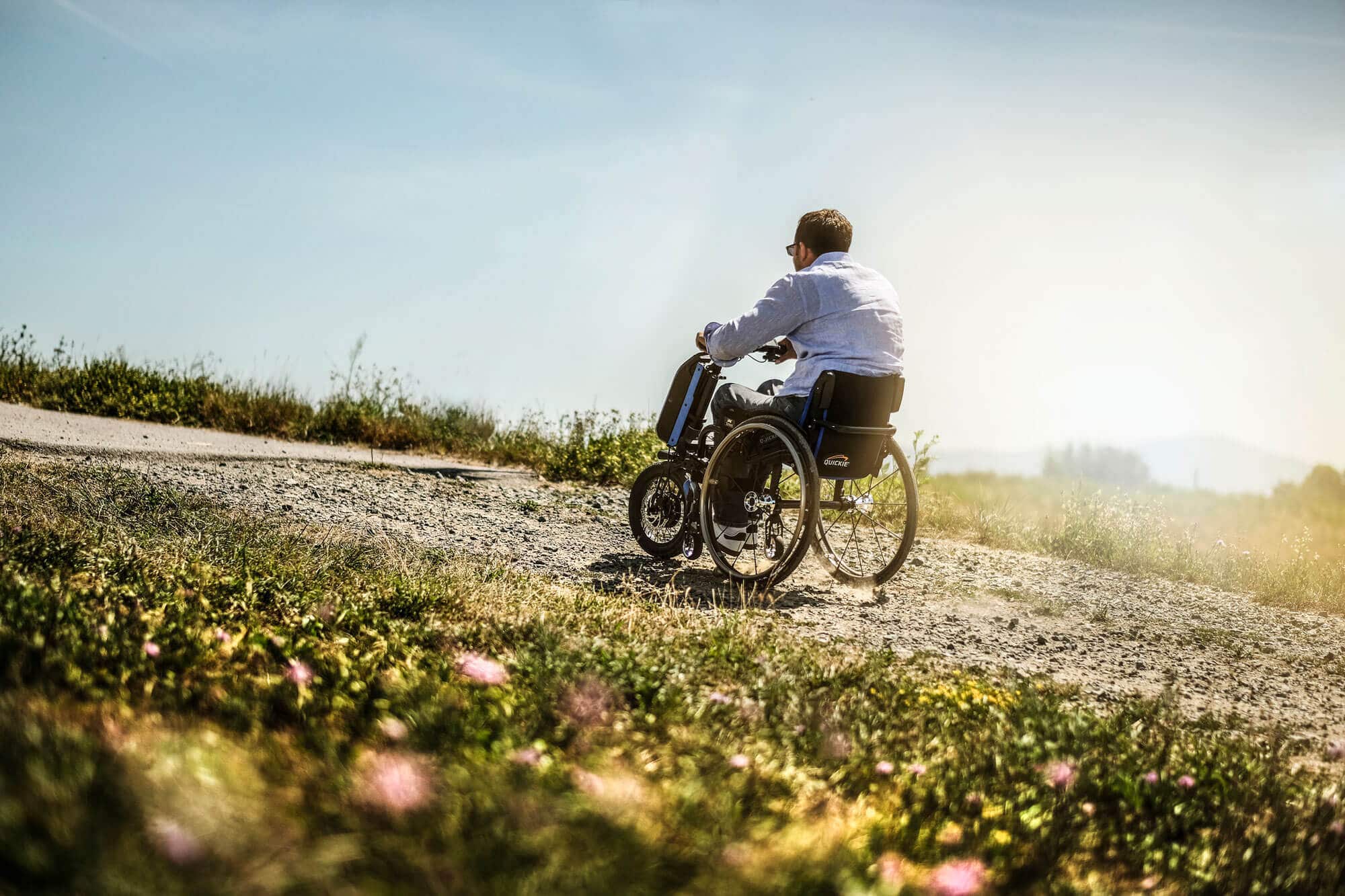 Man riding an active user chair with the Empulse F55 Powerpack add-on