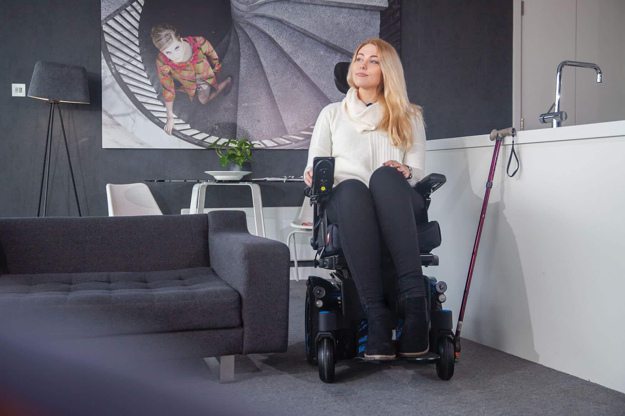 blonde lady sat on q300m mini powerchair